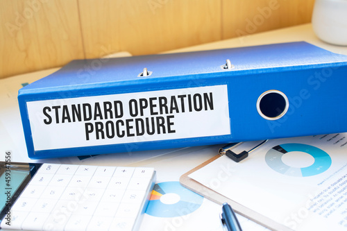 Standard Operation Procedure words on labels with document binders