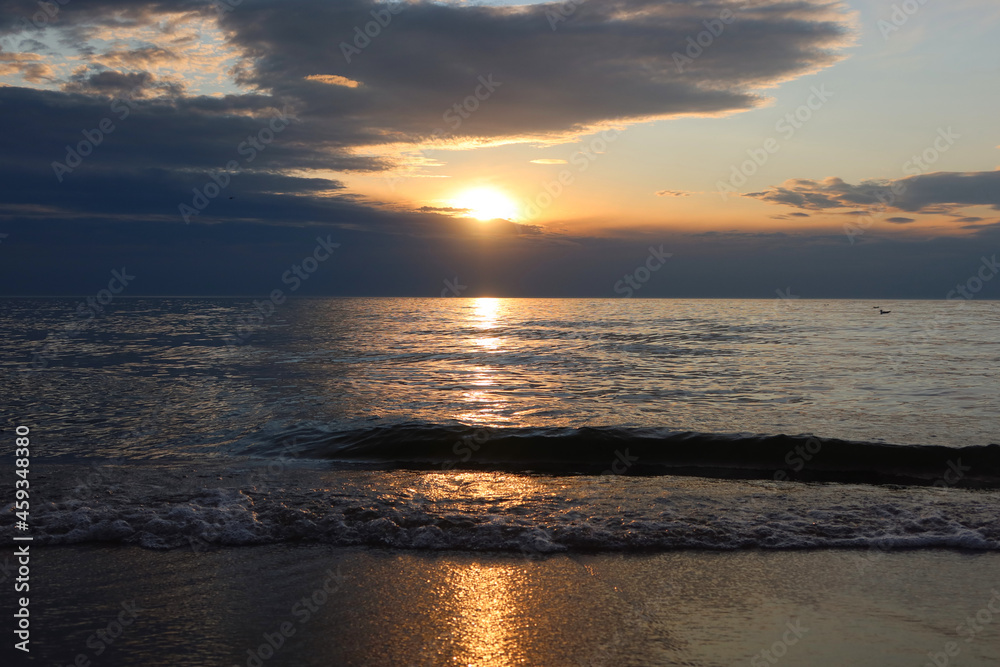 Scenic sunset over the sea. Calm Baltic sea. Poland seaside,  Dabki village and beach. Seascape