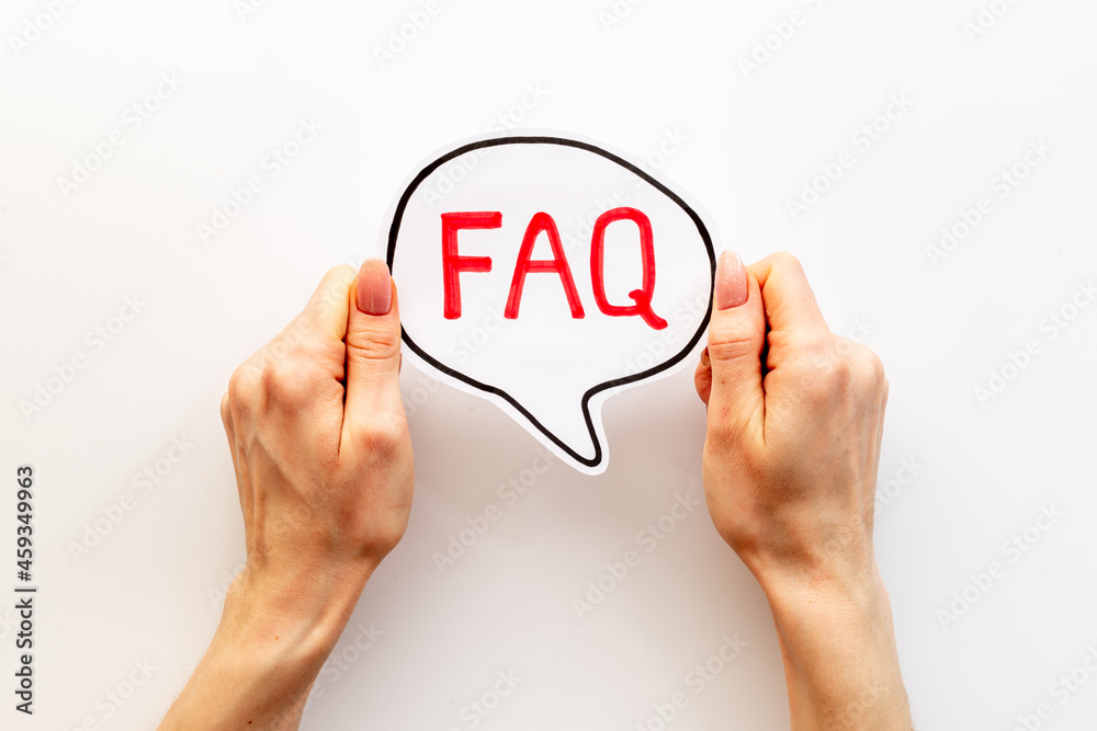 Hands with faq word on paper bubble. Frequently asked questions concept Hands with faq word on paper bubble. Frequently asked questions concept