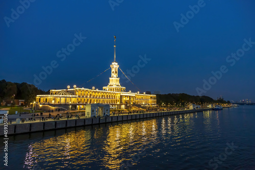 Brightly illuminated evening building of the Northern River Station. Built in 1937. Opened after reconstruction in 2020. Moscow, Russia