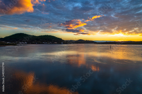 Sunrise waterscape and reflections with clouds