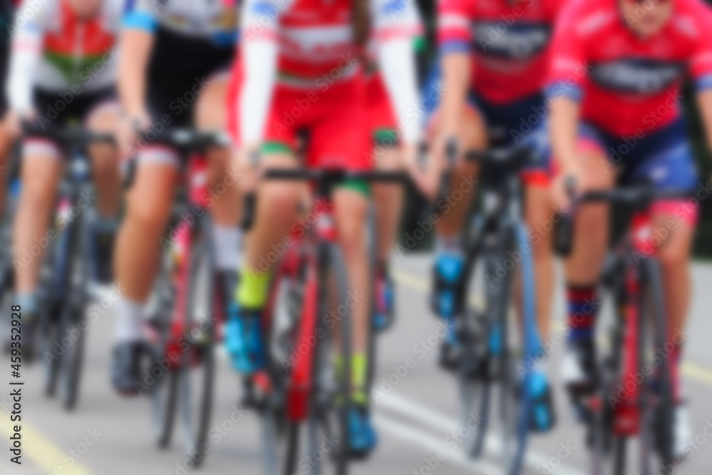 Fototapeta premium Cycling competition, blur image of asphalt road and bikes. Cycling race