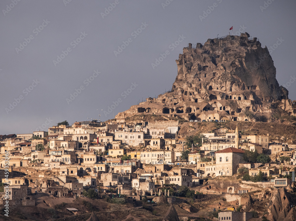 Uchisar, Turkey, old cave houses and modern housing in the morning glow