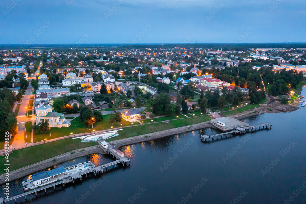 Flight over evening city of Uglich and Epiphany Cathedral on the banks of Volga River