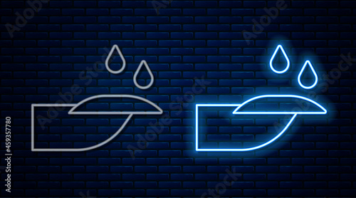 Glowing neon line Nail manicure icon isolated on brick wall background. Vector