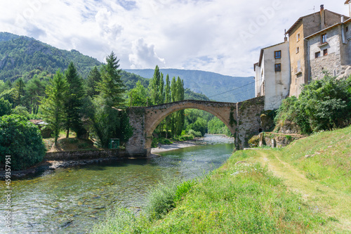 River Noguera Pallaresa passing under a Roman bridge in the town of Gerri de la Sal, Lleida photo