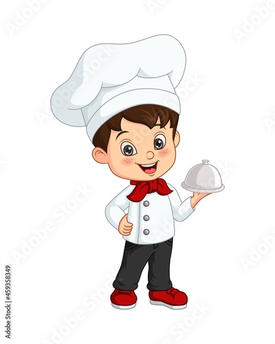 Cute little boy chef holding a silver tray