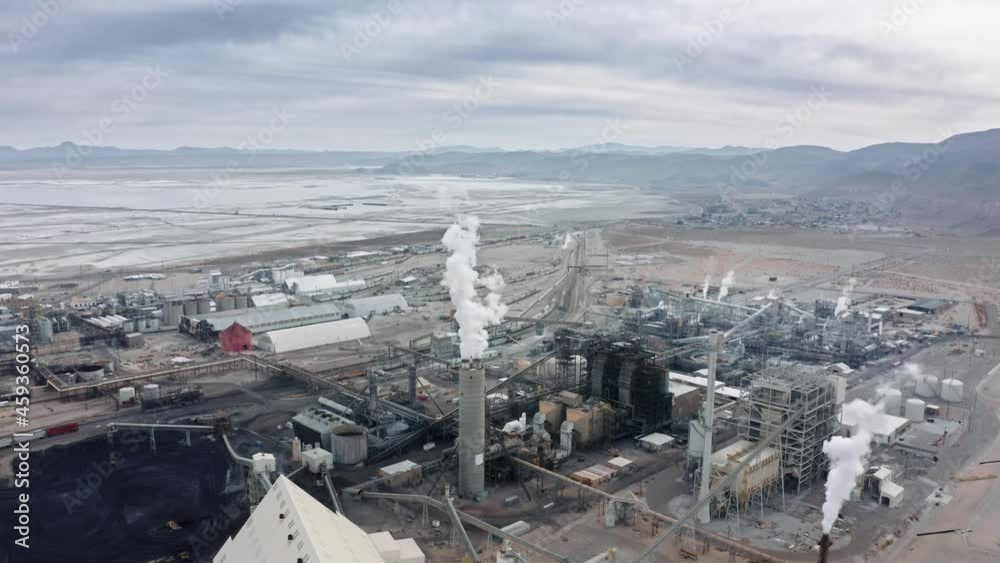 Drone shot of industrial zone with thick smog and burning fossil fuels. Zoom out top aerial shot of dirty factory district, air pollution and soot in many factory chimneys in industrial Sears city USA Drone shot of industrial zone with thick smog and burning fossil fuels. Zoom out top aerial shot of dirty factory district, air pollution and soot in many factory chimneys in industrial Sears city USA