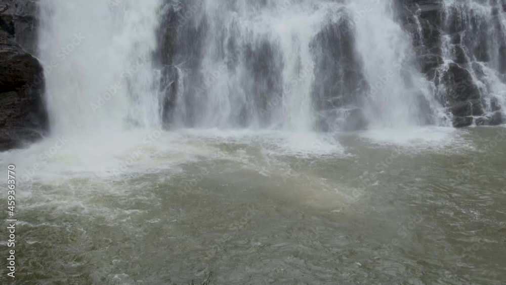 A Close up view of the Abbey Waterfall flowing and joining the Cauvery river in Coorg district of Karnataka, India. A Close up view of the Abbey Waterfall flowing and joining the Cauvery river in Coorg district of Karnataka, India.