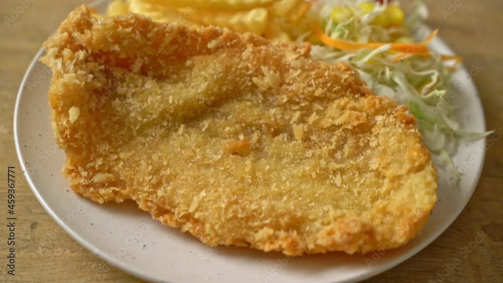 fried fish fillet and potatoes chips with mini salad fried fish fillet and potatoes chips with mini salad
