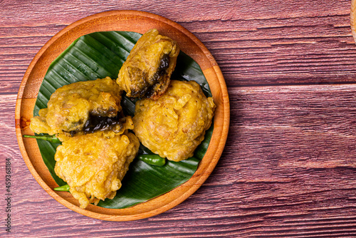 Tahu Petis Crispy, Indonesian traditional food from Semarang City on wooden plate decorated with banana leave