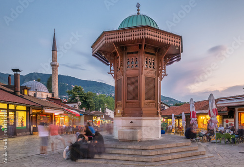 Bascarsija square with Sebilj wooden fountain in Old Town Sarajevo in BiH photo