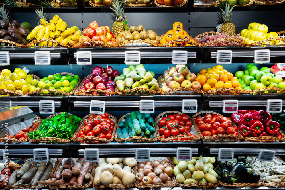 Fresh vegetables and fruits on supermarket shelves