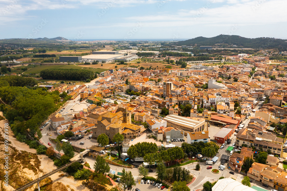 Bird's eye view of Spain city Tordera with skyline in background.