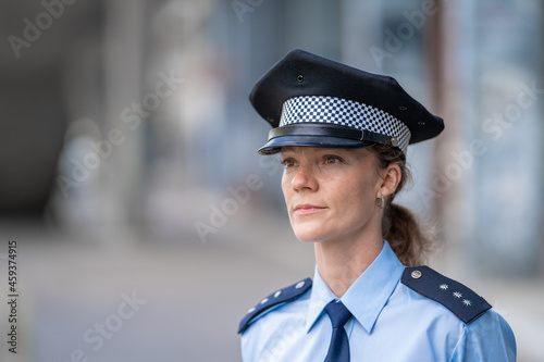 portrait of a young female policewoman in uniform