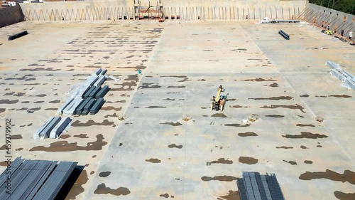 Aerial view of a forklift machine on a large construction site. photo