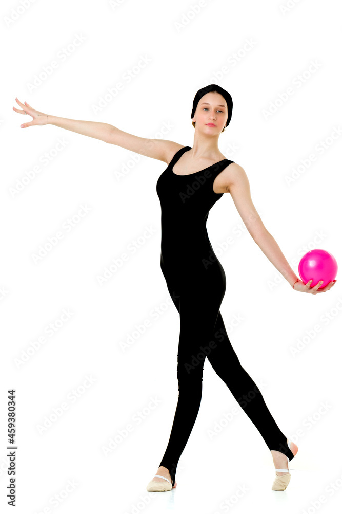 Girl in sports outfit doing gymnastics with ball