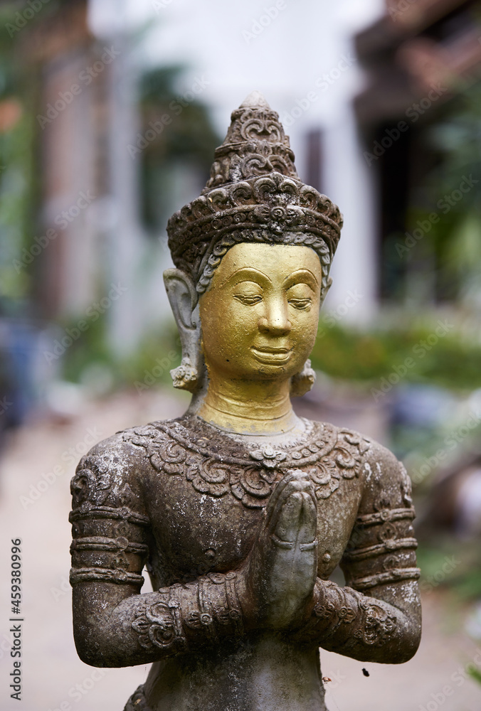 Ancient Buddha statue, closeup. In a quiet and comfortable natural environment 