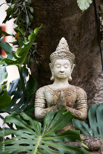 Ancient Buddha statue, closeup. In a quiet and comfortable natural environment 