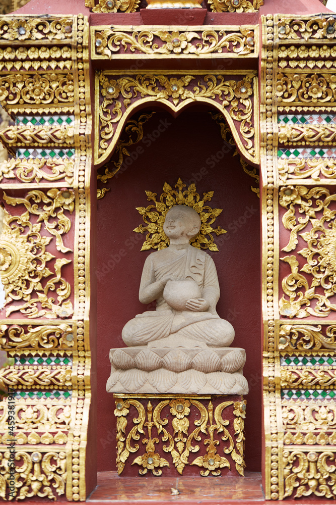 Fototapeta premium Stone statue of Buddha, outside the temple. Chiang Mai, Thailand