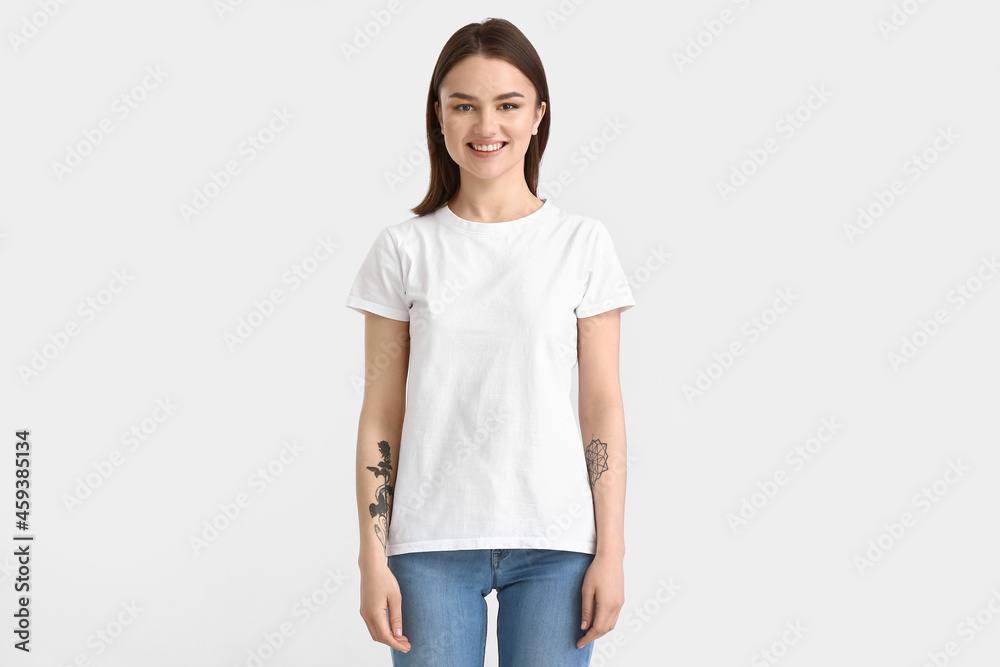 Young woman in modern t-shirt on white background Young woman in modern t-shirt on white background