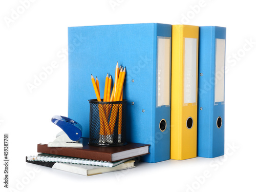 Office folders and stationery on white background