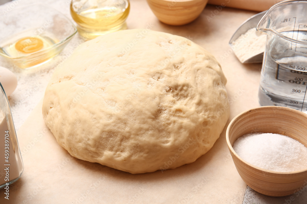 Composition with fresh dough on light background Composition with fresh dough on light background