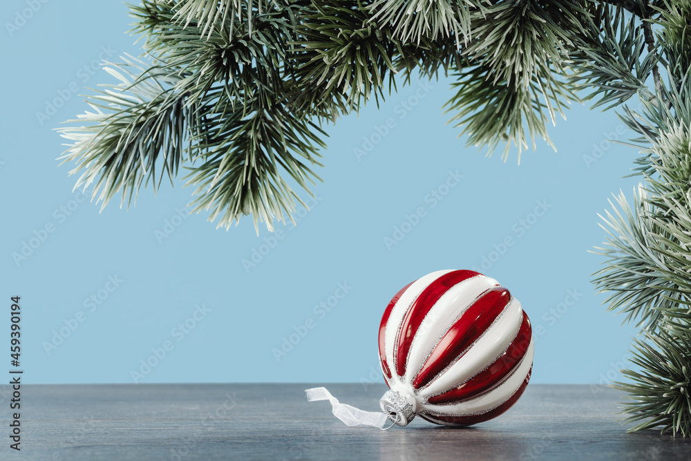 Christmas ornaments. White and red glass bauble under Christmas tree. Happy new year greeting card. Copy space banner