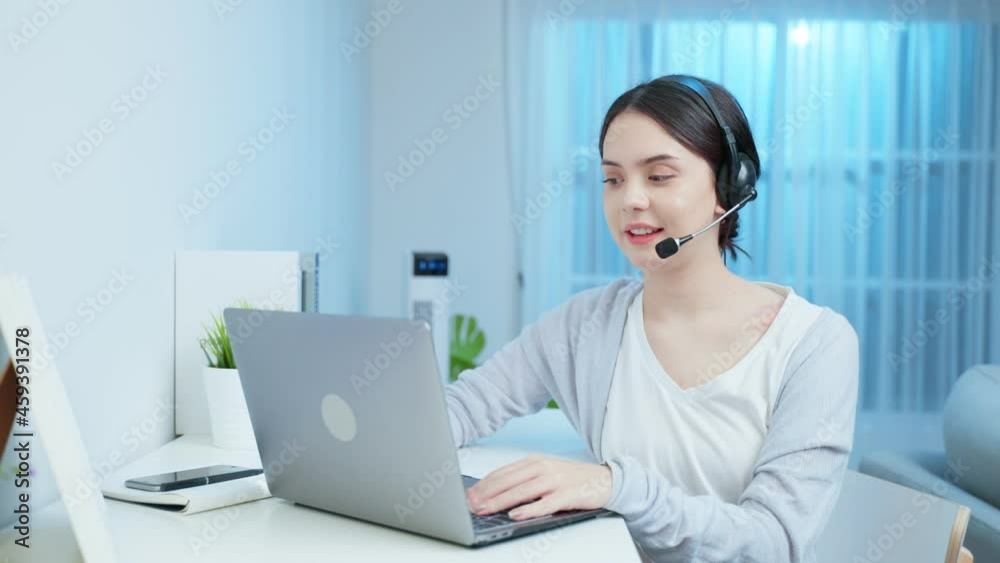 Asian young business woman call center working at home in night time. Asian young business woman call center working at home in night time.