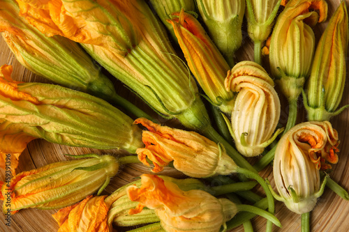 Flowers of zucchini in plate, closeup