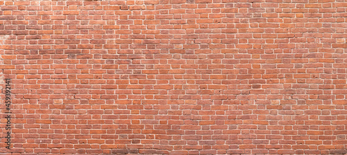 Old red brick wall background, wide panorama of masonry