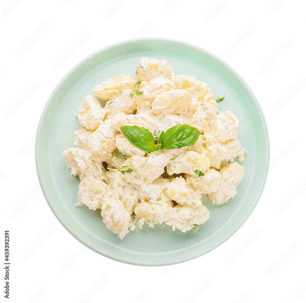 Plate of delicious gnocchi with creamy sauce on white background Plate of delicious gnocchi with creamy sauce on white background