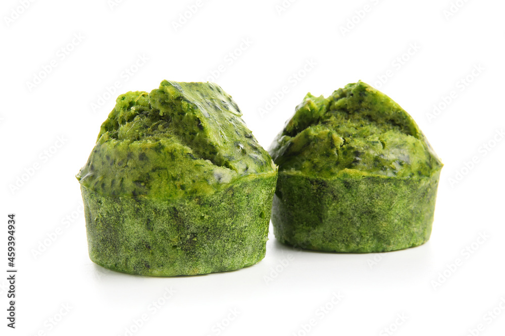 Tasty spinach muffins on white background Tasty spinach muffins on white background