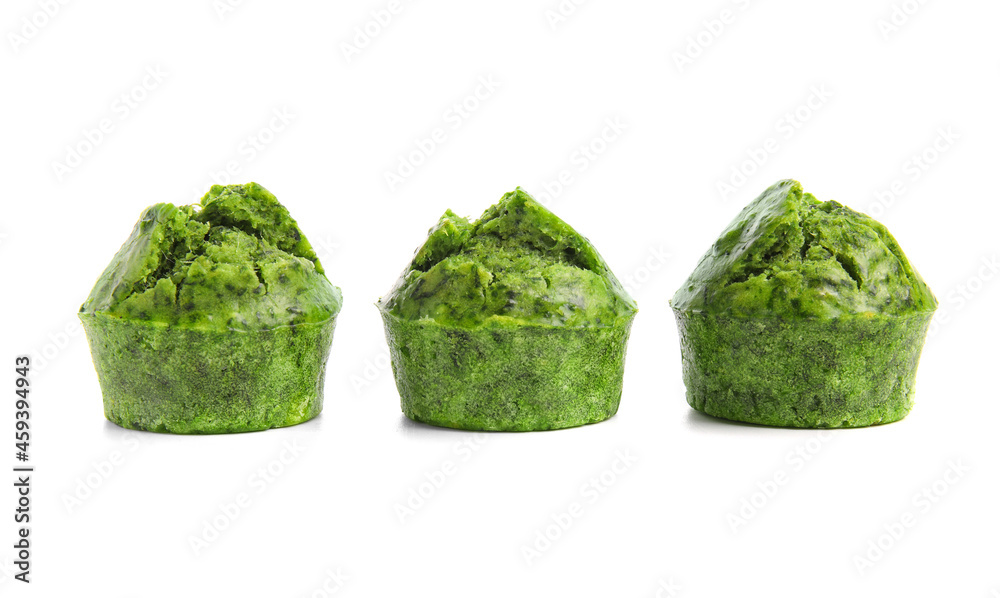 Tasty spinach muffins on white background Tasty spinach muffins on white background