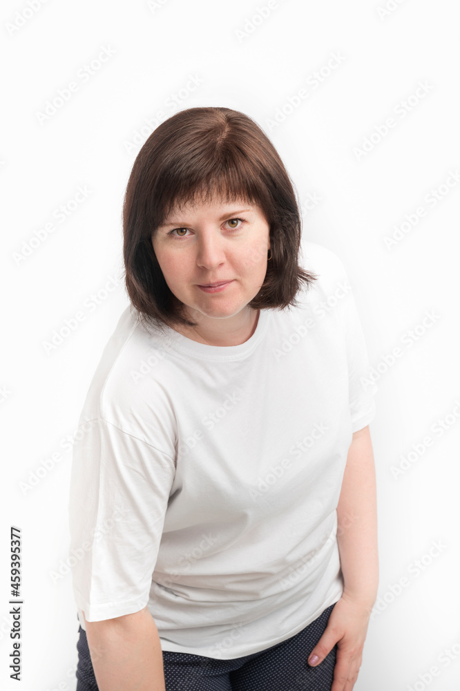 Portrait of young woman with dark hair isolated on white background. Natural appearance of thirty-year-old woman. Portrait of young woman with dark hair isolated on white background. Natural appearance of thirty-year-old woman.
