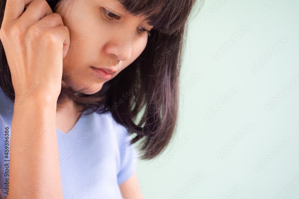 Portrait asian woman sad stressed on green cement background. authentic skin tan and black hair thailand. couple problems and broken heart concept. Portrait asian woman sad stressed on green cement background. authentic skin tan and black hair thailand. couple problems and broken heart concept.