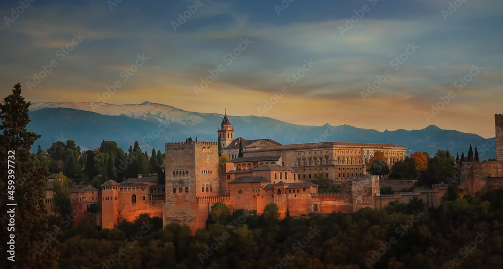 Autumn season fall Background with The landscape  view with Alhambra of Granada, Spain. Alhambra fortress and Albaicin quarter at twilight sky scene