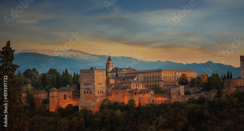 Autumn season fall Background with The landscape view with Alhambra of Granada, Spain. Alhambra fortress and Albaicin quarter at twilight sky scene