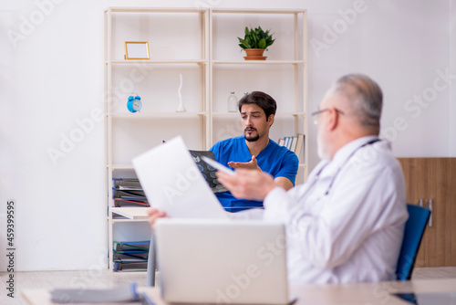 Two male doctors working in the clinic