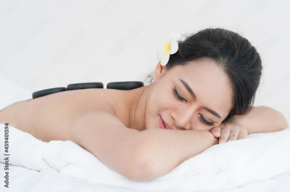 young woman massage in stone spa salon young woman massage in stone spa salon