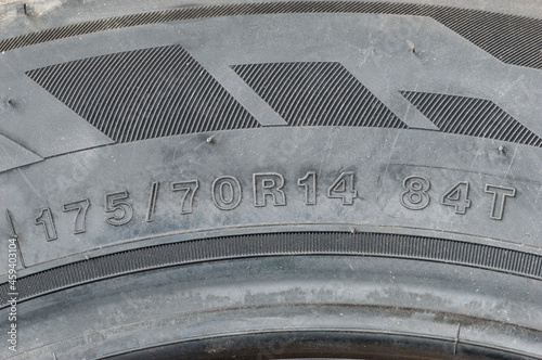 Detail view of tire with tire width, height and wheel diameter designation. photo
