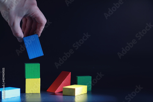 Children's development. Children's wooden toy on the table in the play area. Room of children's creativity and self-development. Wooden constructor.