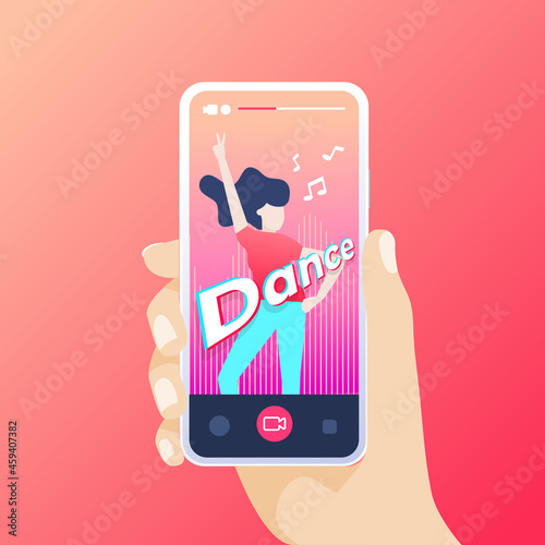 Hand holding smartphone recording a dance video in the application.