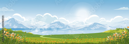Spring landscape in city park in the morning, Natural public park with river, flowers blooming in the garden, Peaceful scene of green fields with lake and blue sky, cloudy in sunny day summer.