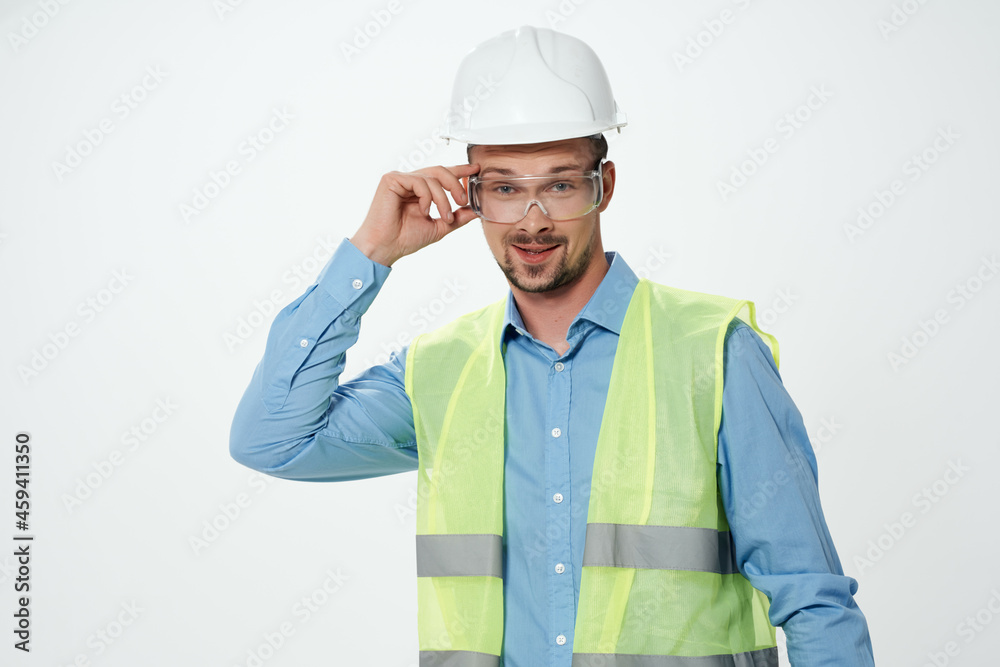 man in white helmet engineer light background