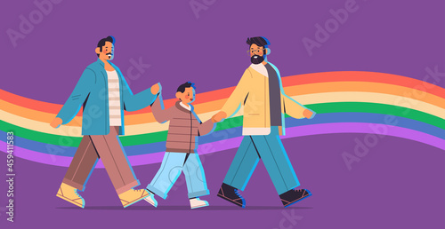 male parents walking with little son gay family transgender love LGBT community concept