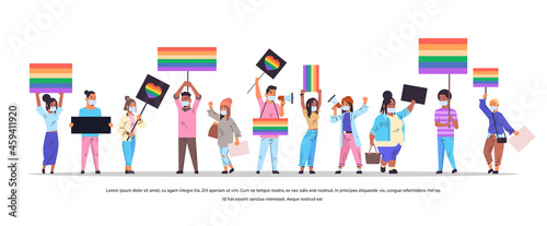 mix race people in masks with LGBT banners on lesbian gay pride festival transgender love LGBT community concept © mast3r