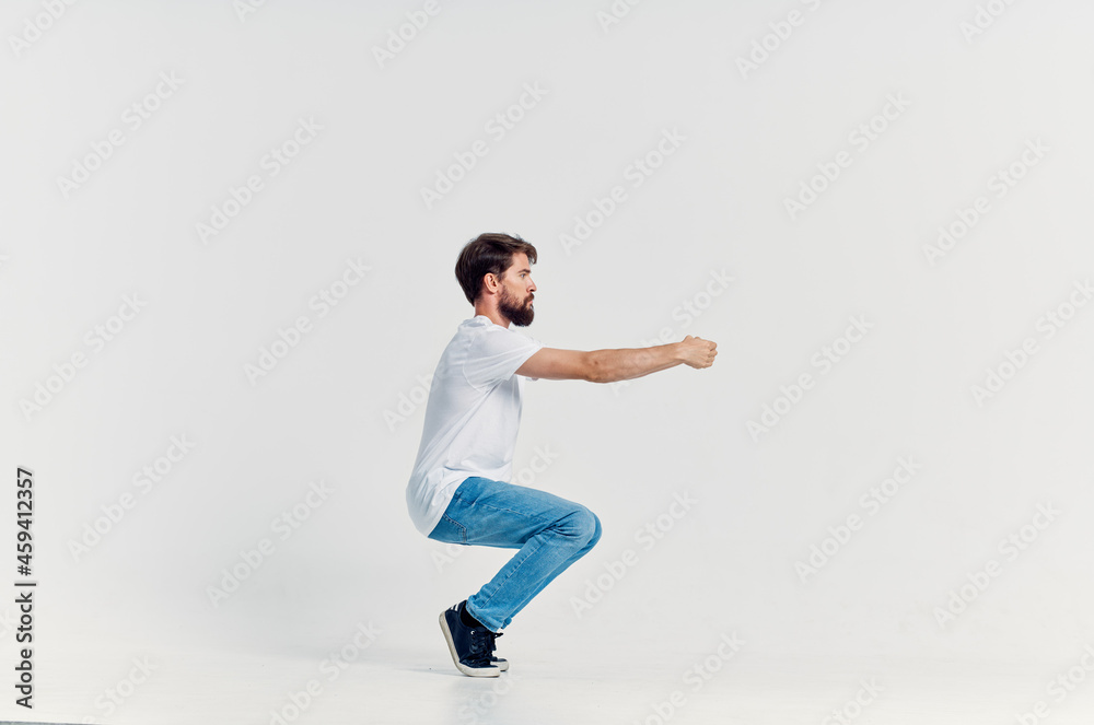 man in white t-shirt emotions posing fun Studio