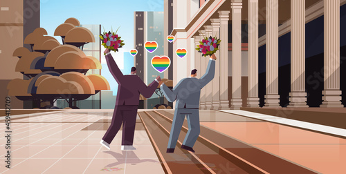 newlywed gay couple with flowers walking outdoor transgender love LGBT community wedding celebration