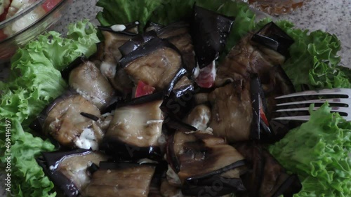 fried eggplants with garlic, mayonnaise and green lettuce photo